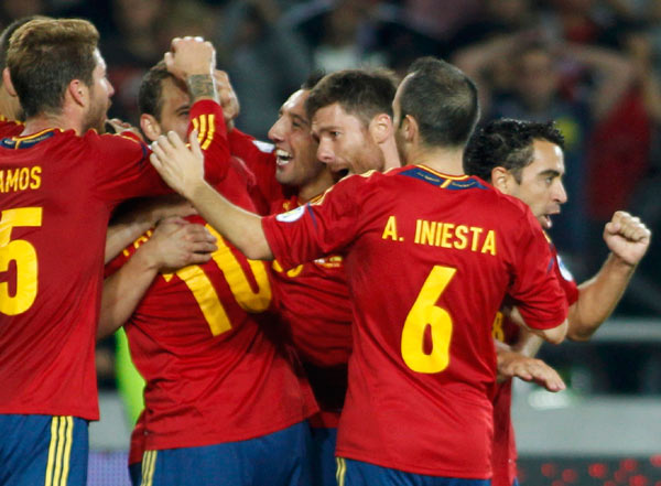 Spain and Germany scrape victories, England held