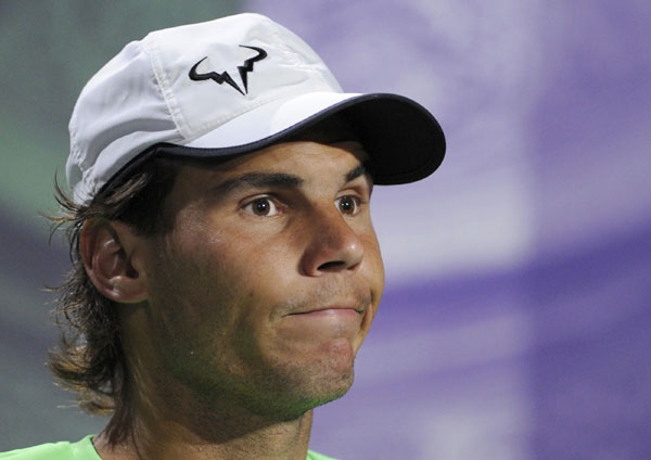 Rafael Nadal of Spain reacts during a news conference after being defeated by Steve Darcis of Belgium in their men's singles tennis match at the Wimbledon Tennis Championships, in London June 24, 2013. Upsets and injuries at 2013 Wimbledon