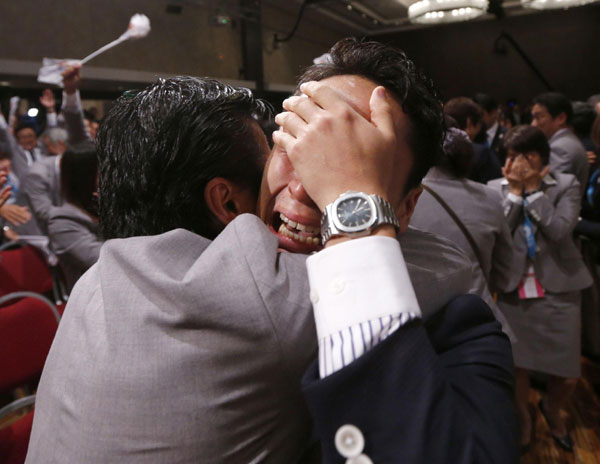 Japanese fencer Yuki Ota cries as Jacques Rogge President of the International Olympic Committee (IOC) announces Tokyo as the city to host the 2020 Summer Olympic Game during a ceremony in Buenos Aires, Sept 7, 2013. Abe speech helps secure 2020 Games for Tokyo
