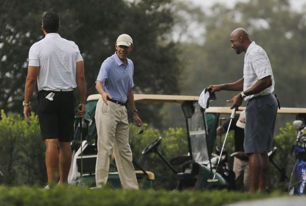 Obama plays golf with NBA player