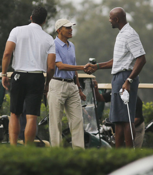 Obama plays golf with NBA player