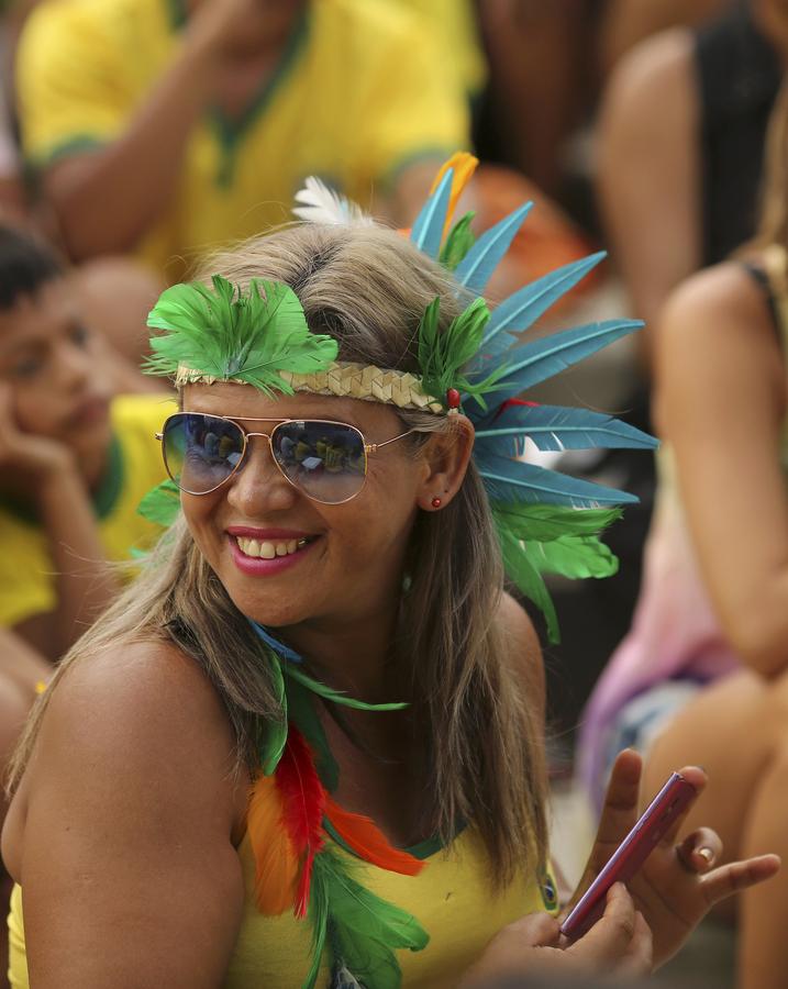 Brazil survives own-goal to win World Cup opener