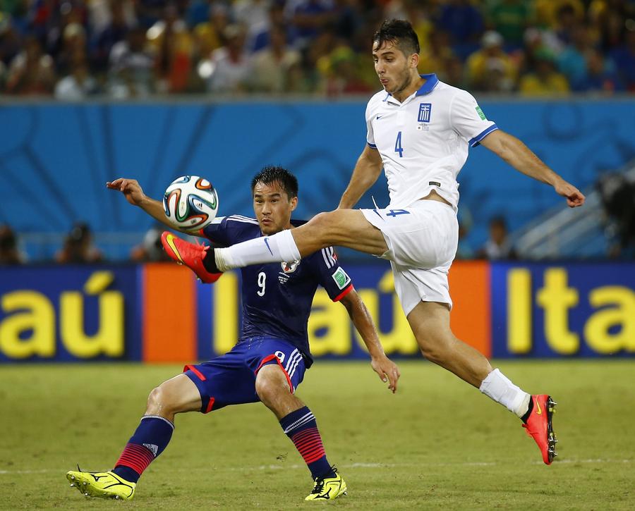 Scoreless draw keeps Japan and Greece alive