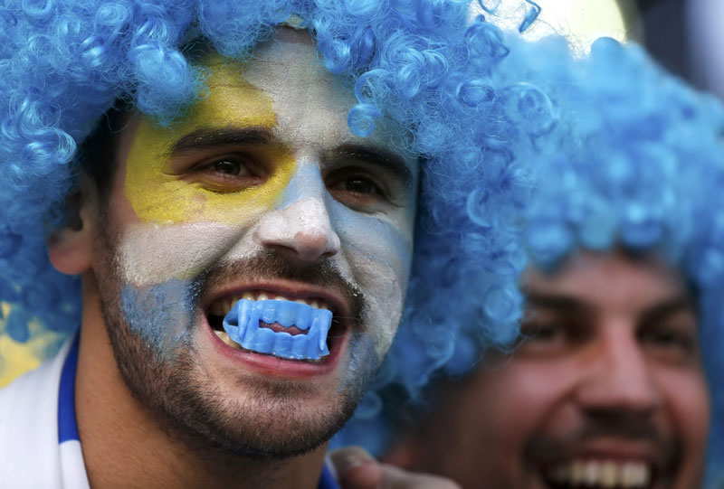 Fans bare their teeth in support of Suarez