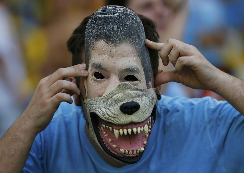 Fans bare their teeth in support of Suarez