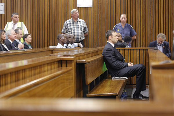 South African judge begins verdict in Pistorius murder trial
