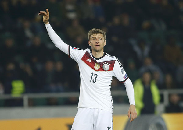 Reus, Mueller on target as Germany eases pas