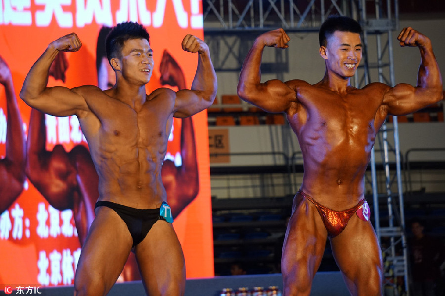 Student body builders flex their muscles on stage