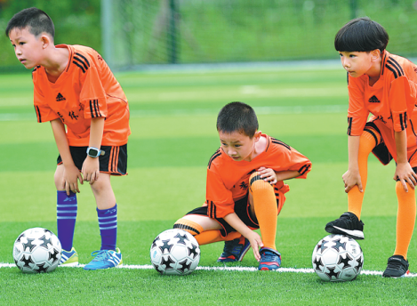 Xinjiang kids look to score on their own field of dreams