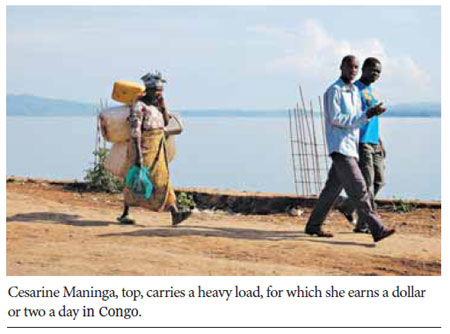 In Congo, burdened by loads and life