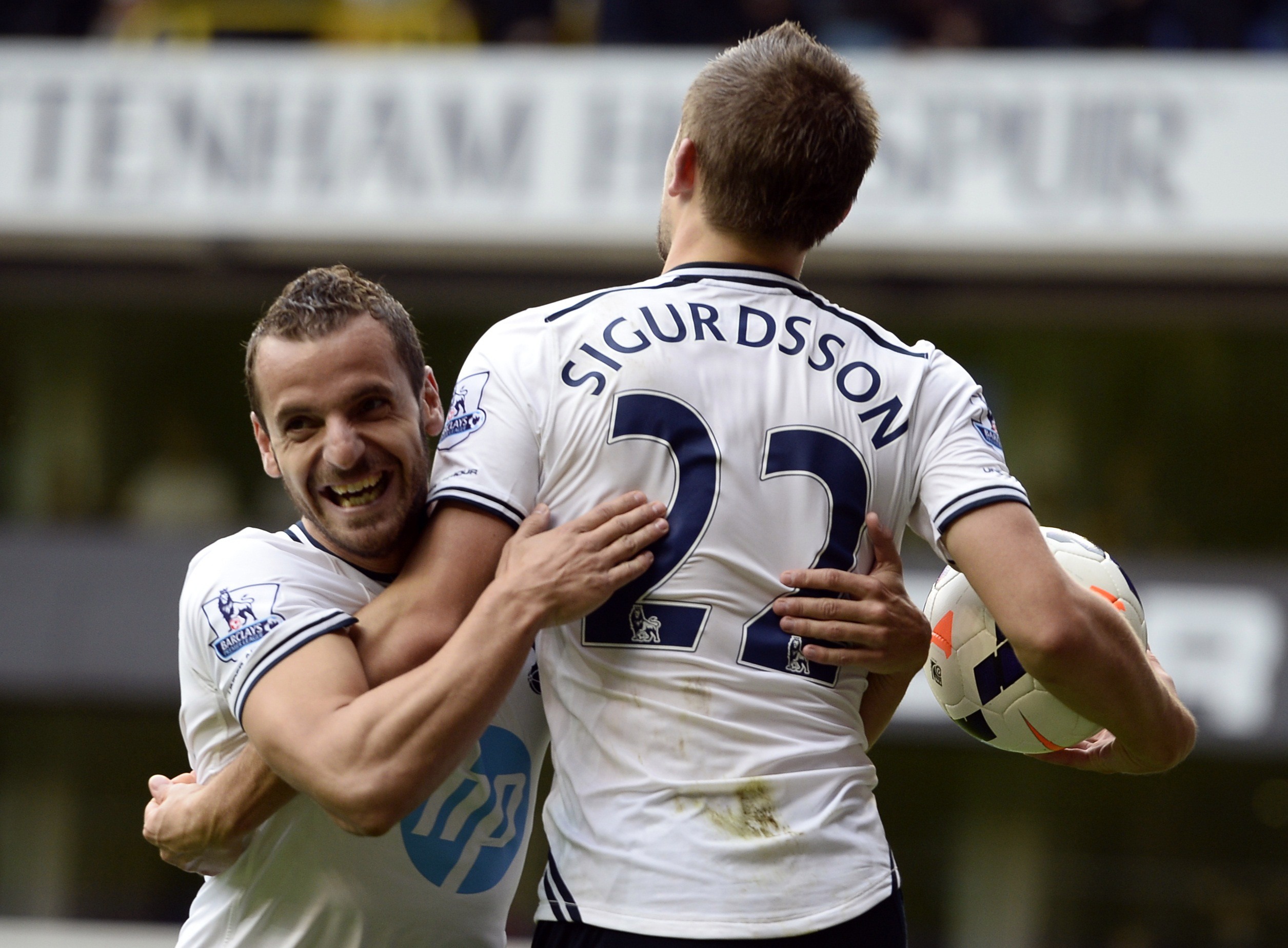 Tottenham Hotspur's Soldado celebrates with team mate Sigurdsson after Sigurdsson scored a second goal during their English Premier League soccer match against Norwich City in London