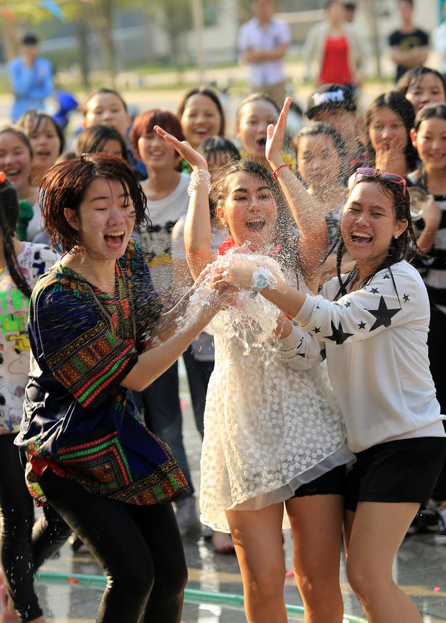 Water-sprinkling festival celebrated by people o