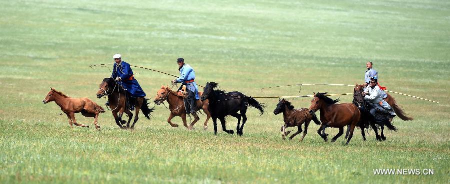 Equestrians ride on grassland of China's Inner Mongolia
