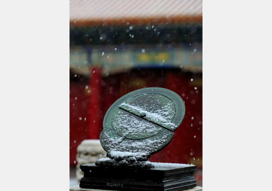 Palace Museum coated in snowfall, a poetic twist to the attraction