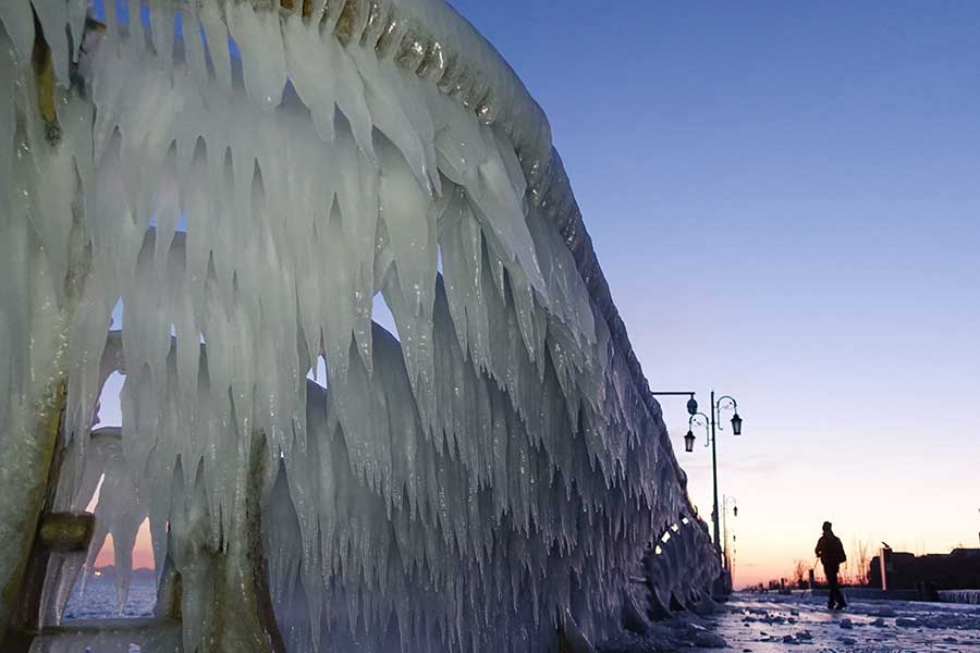 Icicles seen after snowfall on seashore in Dalian