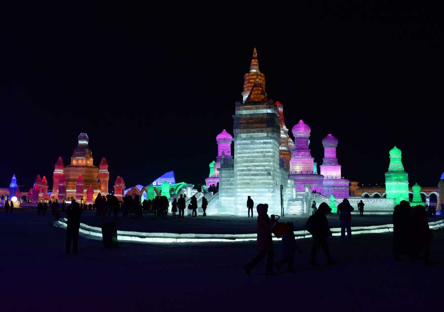 Tourists view shimmering ice sculptures in China's Harbin