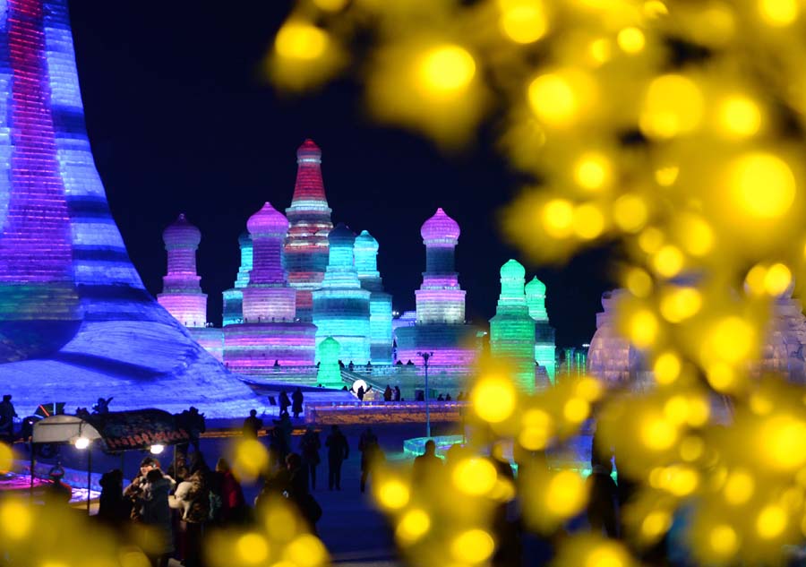 Tourists view shimmering ice sculptures in China's Harbin