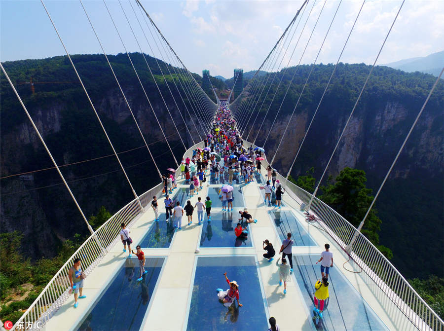 World's longest, highest glass bridge opens in Hunan