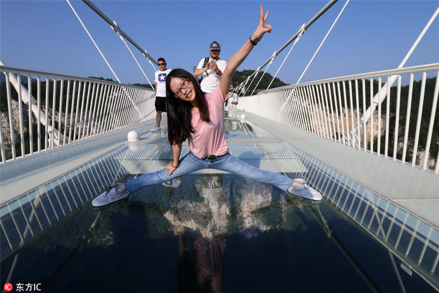 World's longest, highest glass bridge opens in Hunan