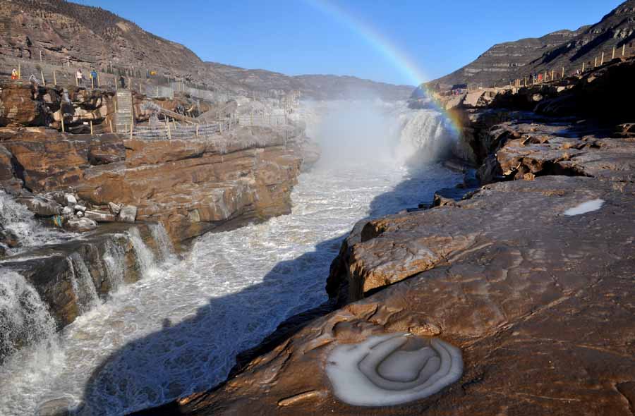 Rainbow arches over Hukou Waterfalls in N China