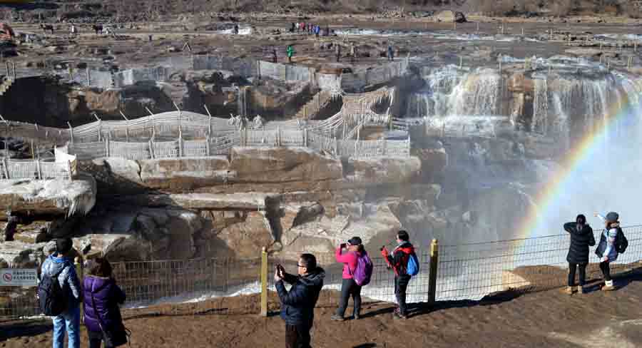 Rainbow arches over Hukou Waterfalls in N China
