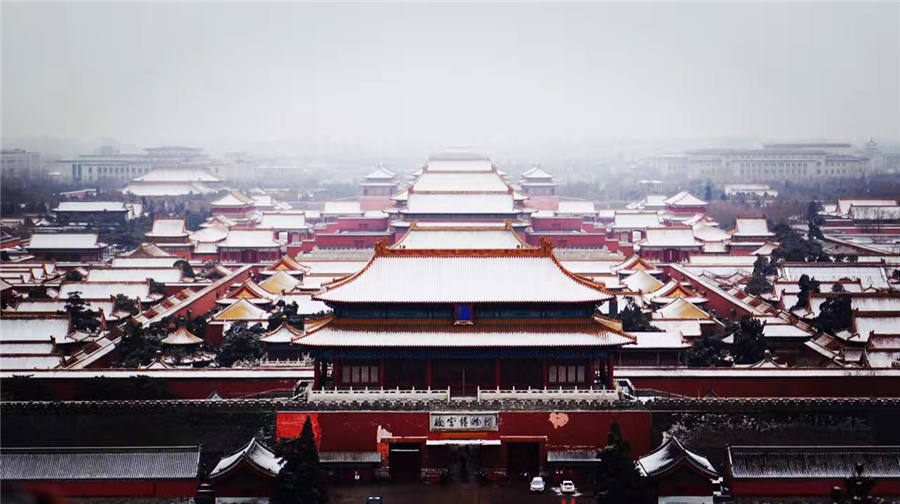 Spring snow blankets Forbidden City