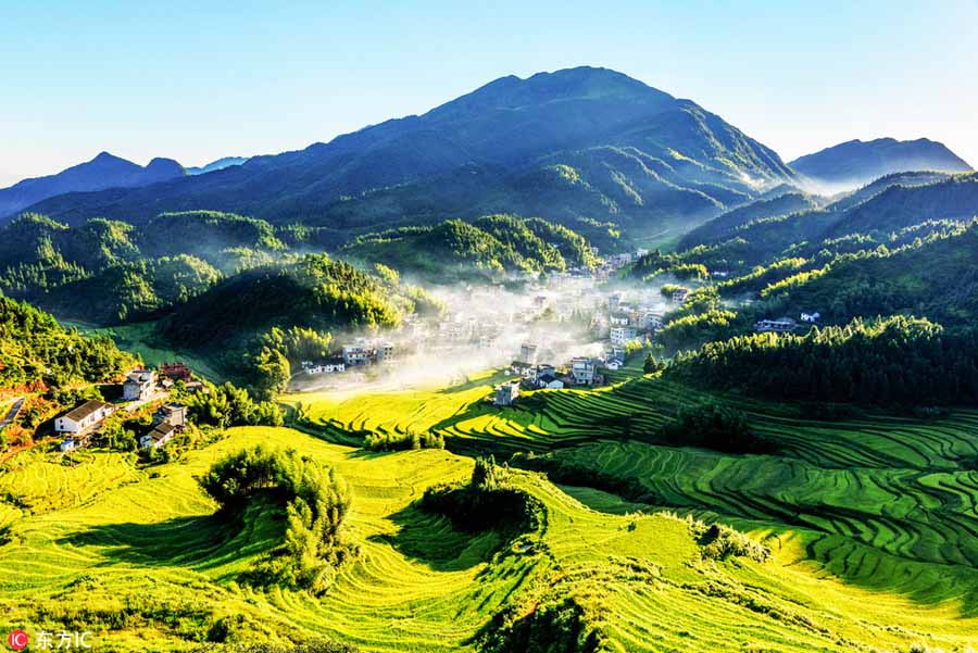 Morning view of autumn in mist at village in Jiangxi
