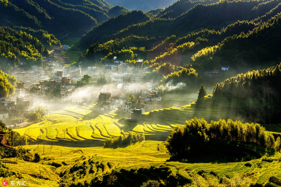 Morning view of autumn in mist at village in Jiangxi