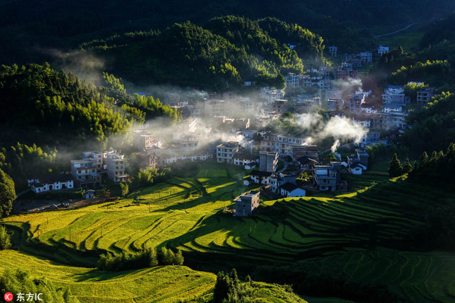 Morning view of autumn in mist at village in Jiangxi