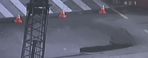 Traffic policeman hailed a hero for saving cars from deep sinkhole
