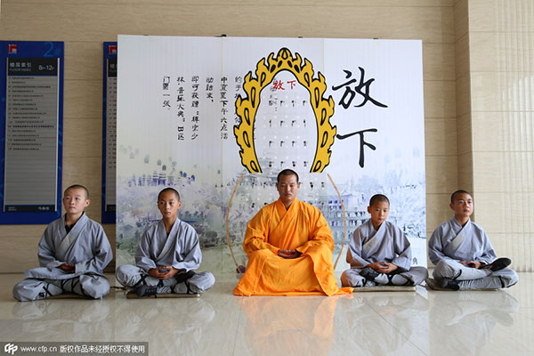Shaolin monks fail to wean people off cellphones