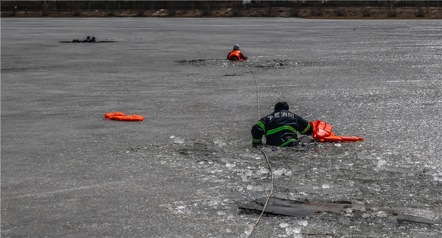 Firefighters rescue boys who fell through thin ice in NW China