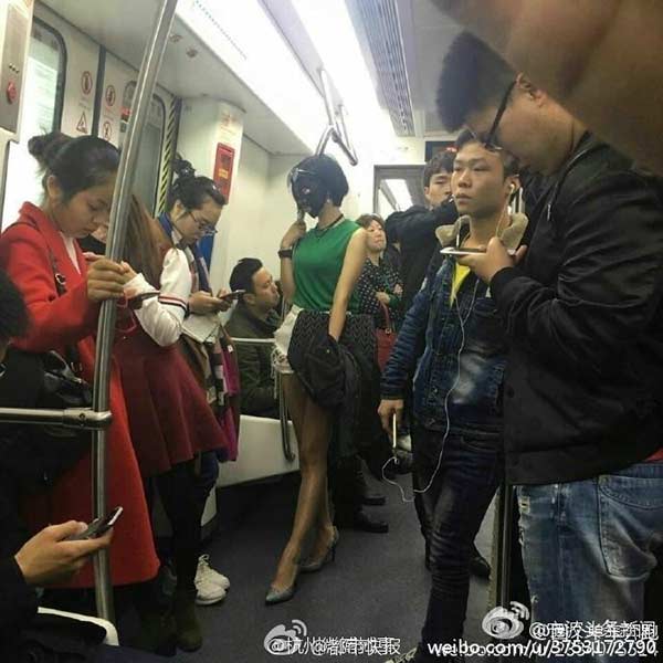 Female rides subway, buses wearing facial mask
