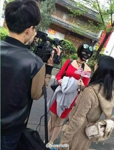 Female rides subway, buses wearing facial mask