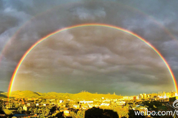 Double rainbow adds color to Beijing's clear blu