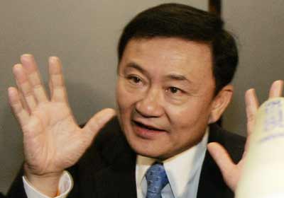 Thailand's Prime Minister Thaksin Shinawatra answers reporters' questions at the Thai Rak Thai party headquarter in Bangkok April 3, 2006. Voters in Bangkok and southern Thailand appeared on Monday to have given Prime Minister Thaksin Shinawatra a slap in the face with a strong protest "No vote" in an election unlikely to end a protracted political crisis. [Reuters]