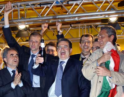 Italy's opposition leader Romano Prodi (C) makes a victory toast with (L-R) politician Arturo Parisi, Democrats of the Left (DS) party leader Piero Fassino, and Margherita party leader Francesco Rutelli during a rally by his centre-left coalition in central Rome April 11, 2006. Prodi claimed a knife-edge victory in Italy's general election on Tuesday, but Prime Minister Silvio Berlusconi's allies disputed the result and demanded a "scrupulous" check of the count. [Reuters]