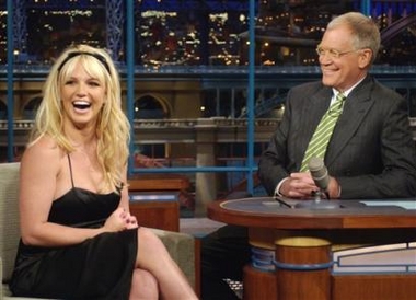 Pop singer Britney Spears shares a laugh with host David Letterman on the set of The Late Show with David Letterman, Tuesday, May 9, 2006 in New York. Spears announced on the show that she and husband Kevin Federline are expecting their second child. [AP/file]