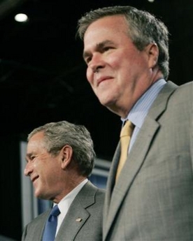 US President Bush, left, is introduced by his brother, Gov. Jeb Bush, right, R-Fla., before speaking on his Medicare Prescription Drug coverage plan at Kings Point Club House, Tuesday, May 9, 2006 in Sun City Center, Fla. [AP]
