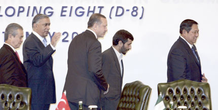 (L to R) Malaysia's Prime Minister Abdullah Ahmad Badawi, Pakistan's Prime Minister Shaukat Aziz, Turkey's Prime Minister Tayyip Erdogan, Iran's President Mahmoud Ahmadinejad and Indonesia's President Susilo Bambang Yudhoyono walk after watching the signing of a trade agreement during the Developing Eight (D-8) summit on the Indonesian island of Bali May 13, 2006. The D-8 groups some of the world's most populous Muslim-majority nations and is aimed primarily at developing economic and trade ties.