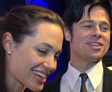 Angelina Jolie, left, and Brad Pitt attend a session of the World Economic Forum in Davos, Switzerland on Jan. 26, 2006. As of Tuesday May 30, 2006,, their child, Shiloh Nouvel Jolie-Pitt, who was born Saturday evening, was reportedly in good health, though the family was yet to make a public appearance. (AP