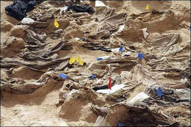 Human skeletons and clothes from persons allegedly executed during the regime of former President Saddam Hussein and now unearthed in a shallow mass grave, in a remote desert south of Baghdad. The trial of Saddam and seven co-defendants for crimes against humanity held a brief session before adjourning until next week as the judge criticized the defense for dragging its feet.(AFP/Erik De Castro) 