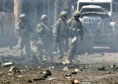 Reuters - Thu Jun 8, 5:54 AM ET U.S. soldiers after a car bomb exploded in Mosul, northwest of Baghdad, May 31, 2006. A House subcommittee approved a bill on Wednesday that would give another $50 billion next year to President Bush for the wars in Iraq and Afghanistan. [Reuters]
