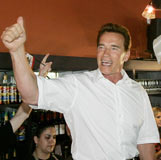 California Governor Arnold Schwarzenegger (C) campaigns inside a local cafe in Chico, California, June 7, 2006. Gov. Schwarzenegger kicked off his first day of campaigning for the upcoming California gubernatorial election in November. [Reuters]