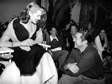 Actress Rita Hayworth chats with director Vincent Sherman, right, between takes of the movie 'Affair In Trinidad' in Hollywood, in this March 1952 file photo. Sherman, who directed Bette Davis, Rita Hayworth and Joan Crawford during his heyday as a leading Hollywood filmmaker in the 1940s and '50s, has died. He would have been 100 on July 16, 2006.