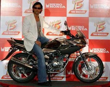 Bollywood actor Hrithik Roshan sits on a newly launched motorcycle at a presentation in New Delhi June 8, 2006. REUTER