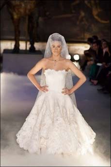 French model Marie de Villepin displays a wedding dress during the Paris haute couture collection in July 2004. De Villepin -- the daughter of French Prime Minister Dominique de Villepin -- has been chosen by the fashion house Givenchy as the model for its latest perfume "Angel or Demon".(