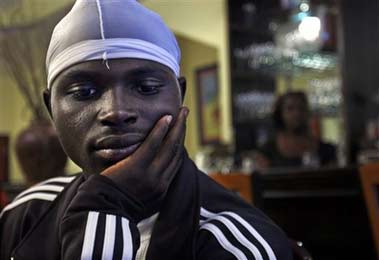 Rasheed Smith, 22, talks about his life during a visit to cafe in the Bedford Stuyvesant section of New York's Brooklyn borough June 6, 2006. Smith, the son of immigrants from the Caribbean island of Barbados, has survived life in the tough neighborhood by staying close to his family. (AP Photo