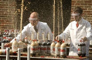 Stephen Voltz, left, and Fritz Grobe, both of Buckfield, Maine, create a geyser effect from a combination of diet soda and Mentos mints, Thursday, June 29, 2006, during a taping of 'Late Show with David Letterman', in New York. (AP Photo/Diane Bondareff)
