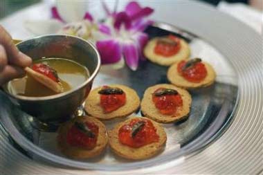 North American Cricket served with pear cactus jelly are displayed on a plate at the Explorers' Club 'Off the Eaton Path' event in New York, in this June 28, 2006 file photo. Founded in 1904, the exclusive international club has some 3,000 members around the world including Edmund Hillary, the first man to climb Mount Everest, astronaut John Glenn and paleontologist Richard Leakey. On the menu at a reception for some lesser mortals this month were worms, crickets, scorpions, ants and pigeon pate. (Scott Schumaker/Reuters) 